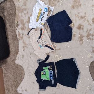 3 short sleeved onesies and 2 pairs of shorts
